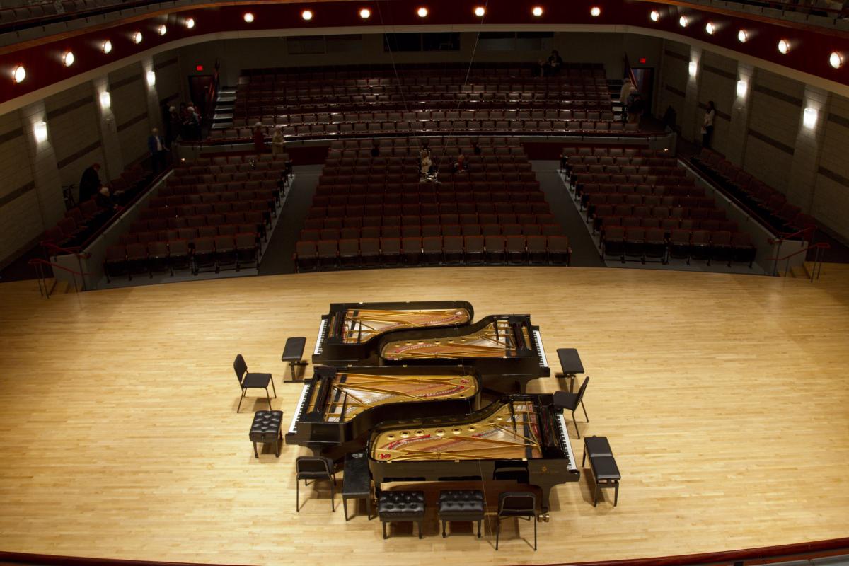 Stage with four pianos