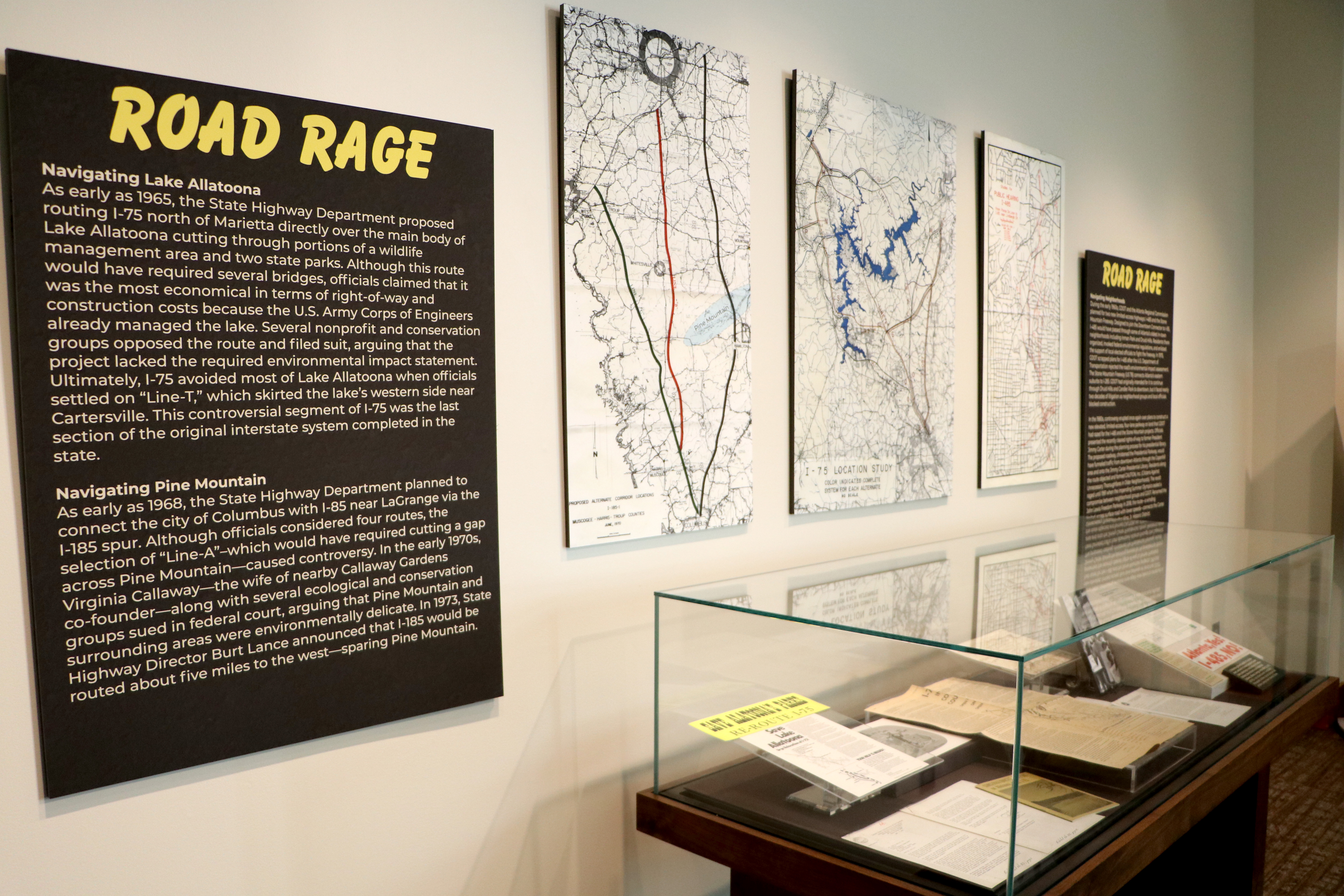 Display case with road signs and maps "Road Rage"