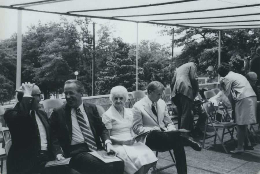 Dedication of the Russell Library June 22, 1974. Governor Jimmy Carter is seated with (l to r) Rev. Dr. Henry Edward "Jeb" Russell, U.S. Senator Henry M. “Scoop” Jackson, and Ina Dillard Russell Stacy. 