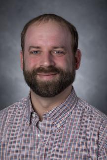 Bearded man wearing checked shirt