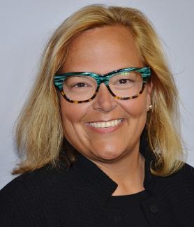 Photo of smiling woman with blonde, shoulder-length hair