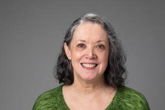 Woman smiling with green shirt