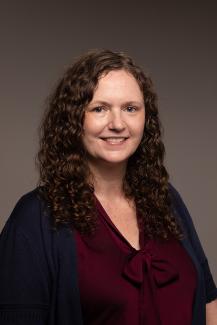 Woman with curly hair smiling