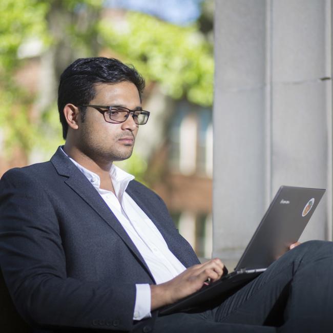 Student working online at Main Library